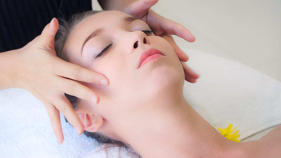 woman having a facial massage